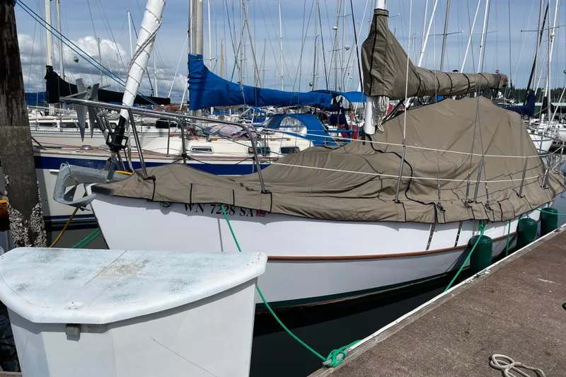 Slide: The Image of Sailboat Devlin Onyx 2013 docked in marina, covered with protective tarp. - 31