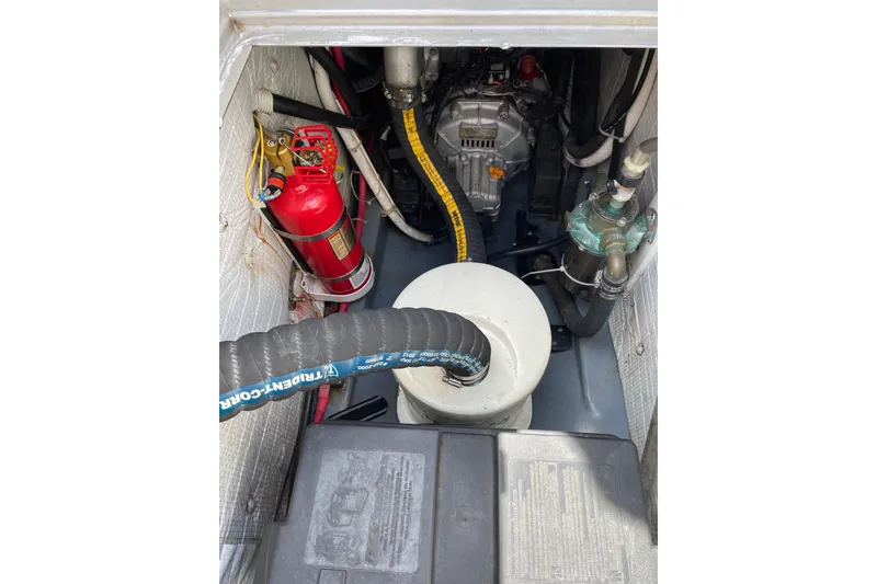 Slide: The Image of Engine compartment of 2013 Devlin Onyx with fire extinguisher and hoses visible. - 32