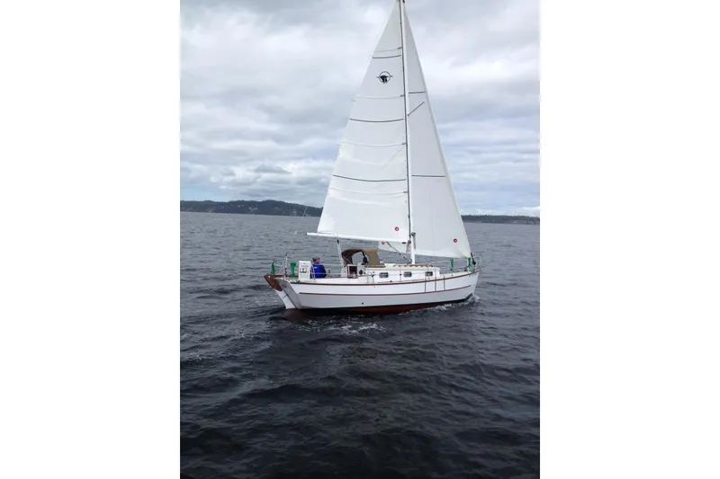Slide: The Image of Sailboat on open water, Devlin Onyx 2013, under cloudy skies. - 35