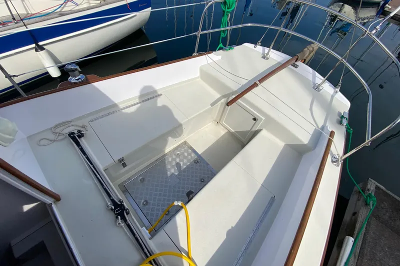 Slide: The Image of Cockpit of 2013 Devlin Onyx boat with seating and storage compartments. - 8