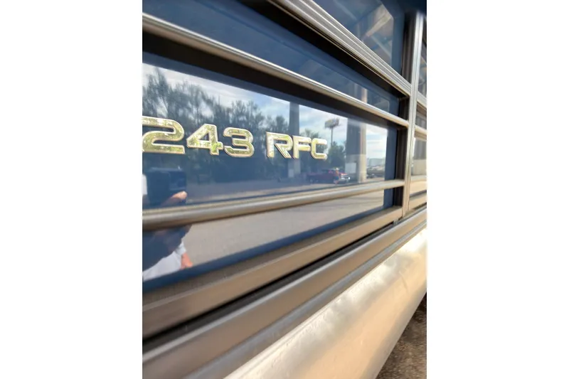 Slide: The Image of 2026 Coach 243 RFC model badge on vehicle exterior. - 20