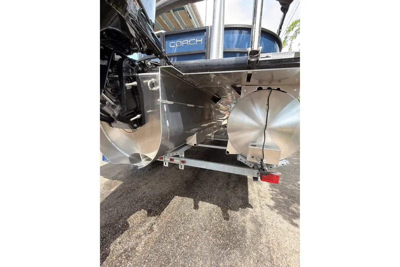 Slide: The Image of Underneath view of a 2026 Coach 243 boat, showcasing its sleek aluminum pontoons. - 24