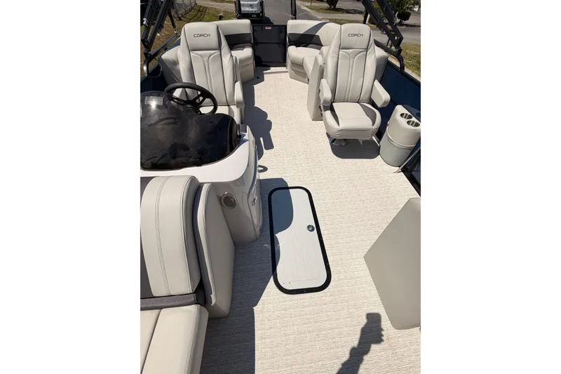 Slide: The Image of Luxurious interior of 2026 Coach 243 boat with plush seating and modern design. - 7