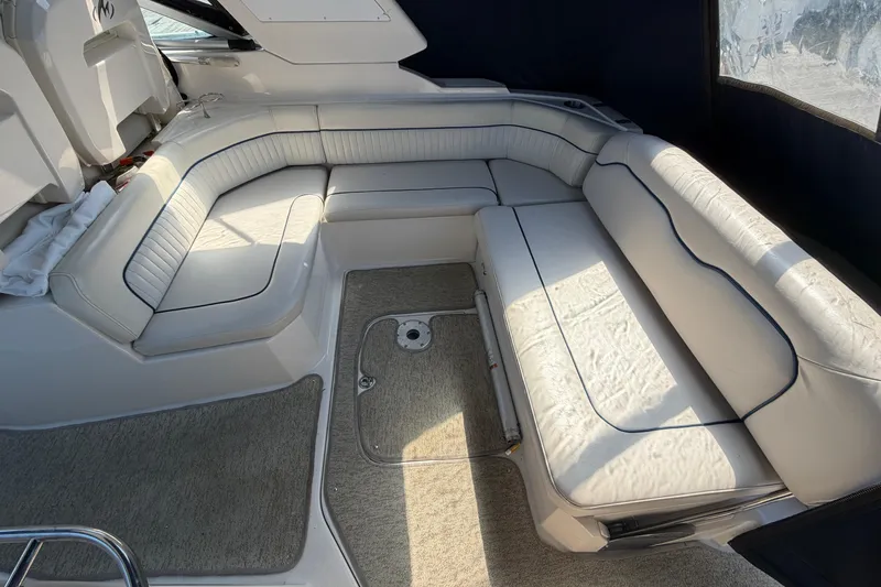 Slide: The Image of Luxurious seating area on a 2007 Monterey 330 Sport Yacht with white upholstery. - 11