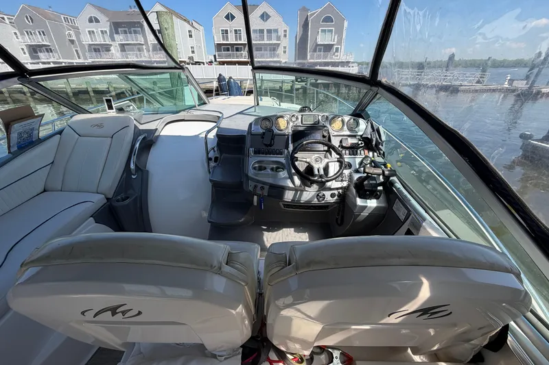 Slide: The Image of Interior view of a 2007 Monterey 330 Sport Yacht cockpit with waterfront background. - 17