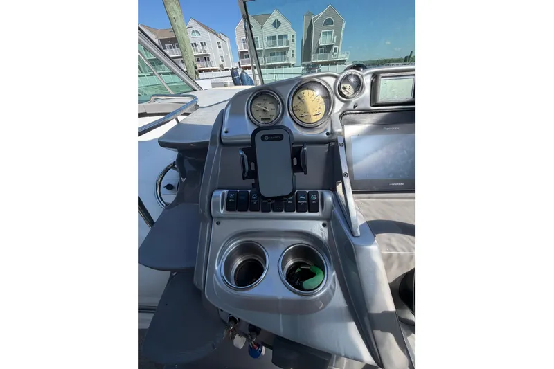 Slide: The Image of Control panel of a 2007 Monterey 330 Sport Yacht with gauges and navigation equipment. - 23