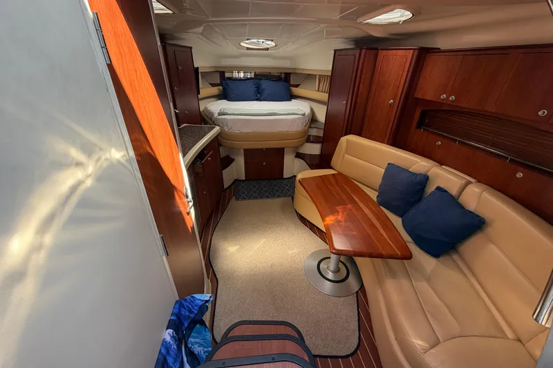 Slide: The Image of Interior of 2007 Monterey 330 Sport Yacht with cozy seating and elegant wood finishes. - 27