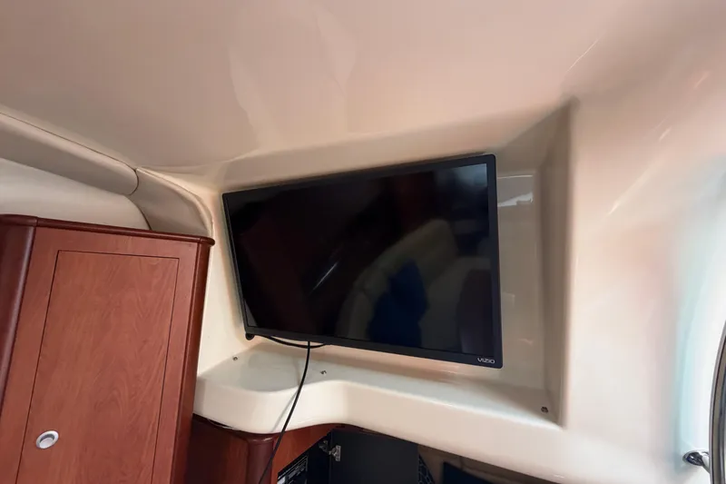 Slide: The Image of Flat-screen TV mounted in 2007 Monterey 330 Sport Yacht interior. - 33