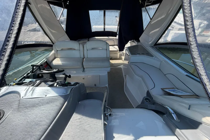 Slide: The Image of Interior view of a 2007 Monterey 330 Sport Yacht with white seating and helm. - 5