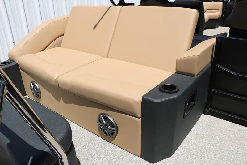 Slide: The Image of Luxurious beige seating on 2026 Evotti 521CS boat, featuring built-in speakers and cup holders. - 29