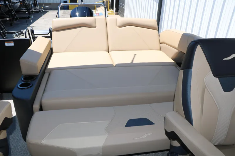 Slide: The Image of Luxurious seating on 2026 Evotti 521CS boat, featuring beige upholstery and cup holders. - 31