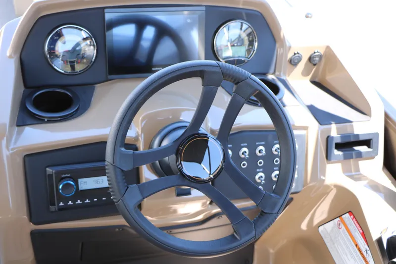 Slide: The Image of Steering console of 2026 Evotti 521CS boat with modern controls and gauges. - 36