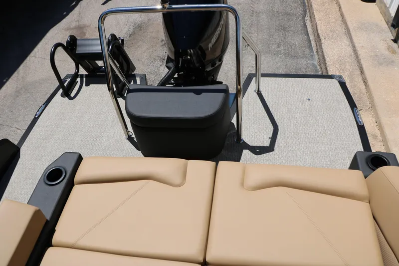 Slide: The Image of Rear view of 2026 Evotti 521CS boat with tan seating and motor. - 42