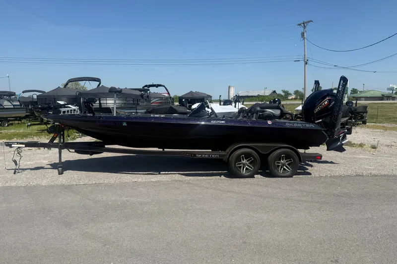 The Image of 2025 Skeeter ZXR21 boat on trailer in outdoor lot, clear sky background. - 1