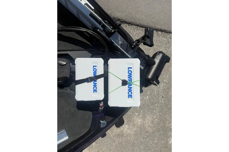 Slide: The Image of Lowrance equipment on a 2025 Skeeter ZXR21 boat, featuring dual mounted units. - 11