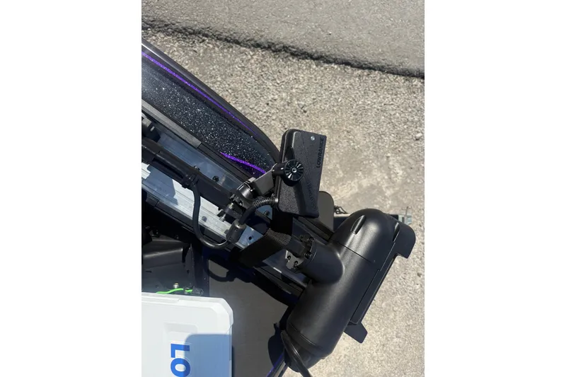 Slide: The Image of Close-up of Skeeter ZXR21 boat equipment, featuring a mounted device and textured surface. - 12
