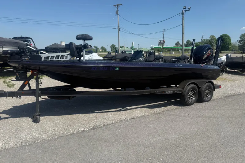 Slide: The Image of 2025 Skeeter ZXR21 boat on trailer in outdoor setting. - 3