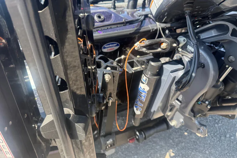 Slide: The Image of Close-up of 2025 Skeeter ZXR21 boat engine components and wiring. - 8