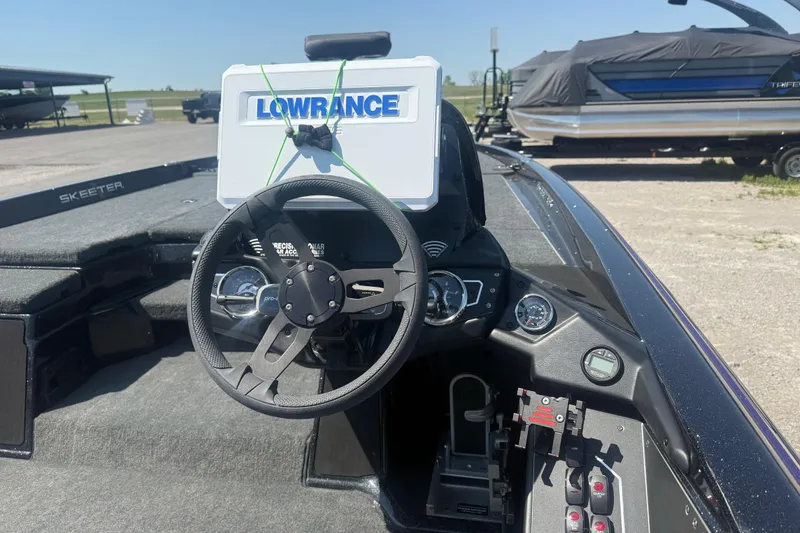 Slide: The Image of Cockpit of 2025 Skeeter ZXR21 boat with Lowrance navigation system. - 9