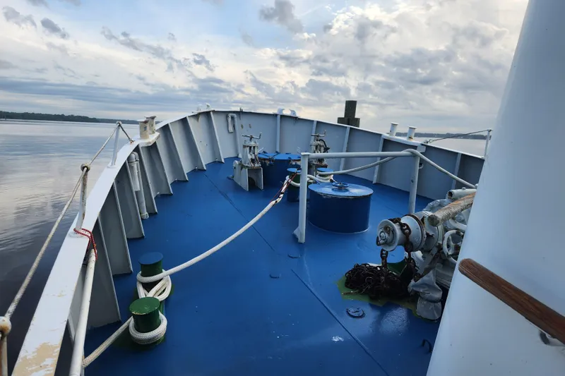 Slide: The Image of Bow of a 1960 Stord Verft model 60 ship with blue deck and nautical equipment. - 10