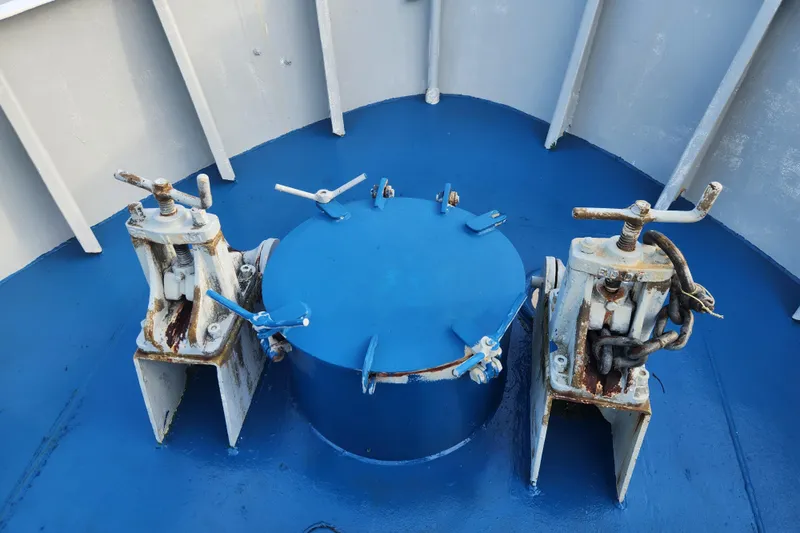 Slide: The Image of Rusty mechanical components on a blue deck of a 1960 Stord Verft model 60 vessel. - 14