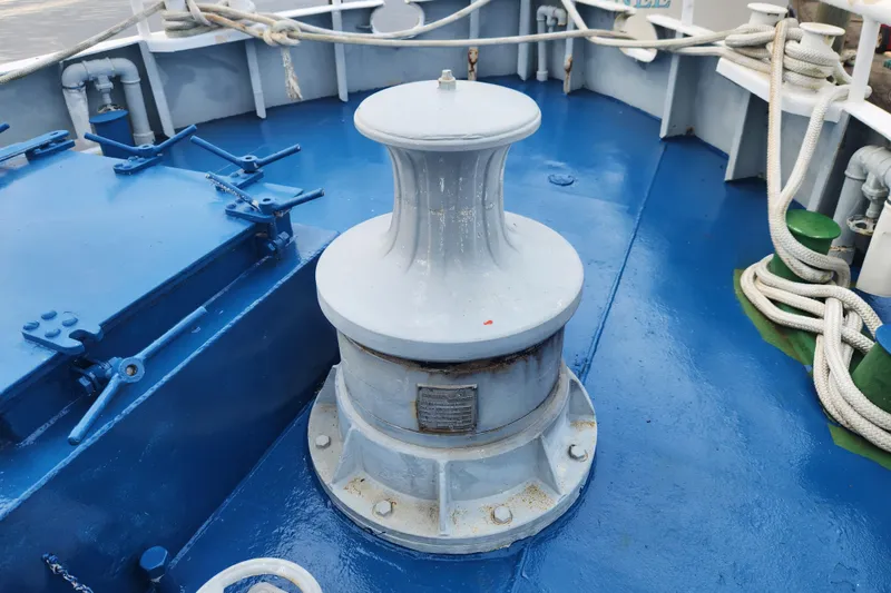 Slide: The Image of Deck equipment on a 1960 Stord Verft 60 ship, featuring a capstan and ropes. - 25