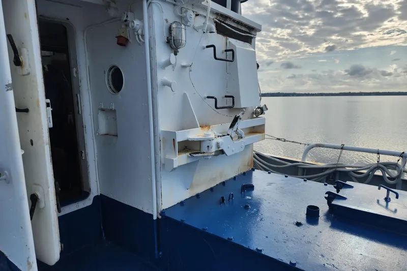 Slide: The Image of Exterior view of a 1960 Stord Verft 60 ship with ocean backdrop. - 26