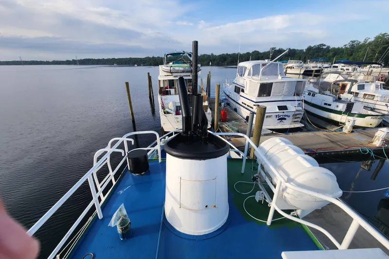 Slide: The Image of Stord Verft 60 boat from 1960 docked at a marina with other vessels. - 39