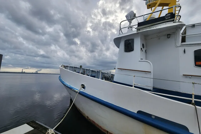 Slide: The Image of White Stord Verft 60 ship from 1960 docked under cloudy skies. - 4