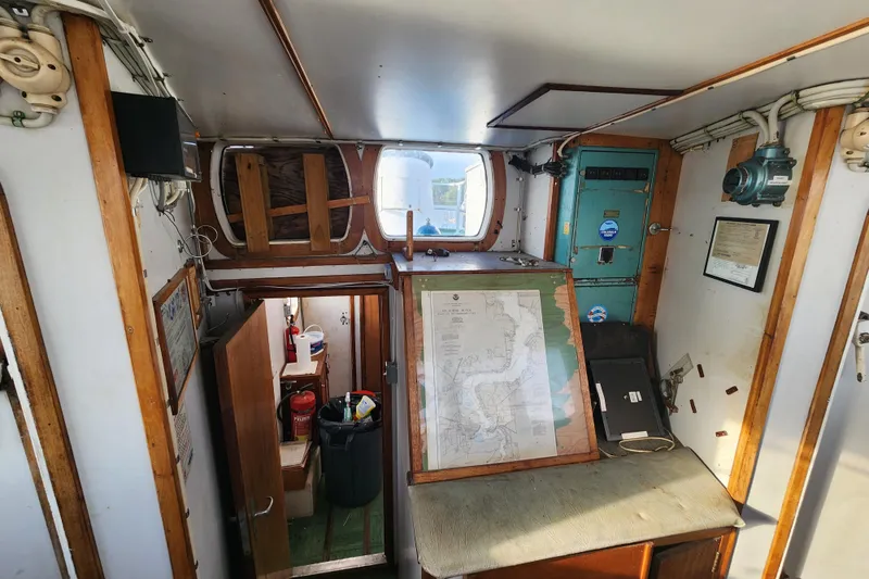 Slide: The Image of Interior of a 1960 Stord Verft model 60 boat with nautical map and equipment. - 44