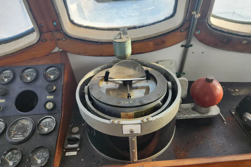 Slide: The Image of Vintage ship's compass and control panel from a 1960 Stord Verft model 60 vessel. - 45