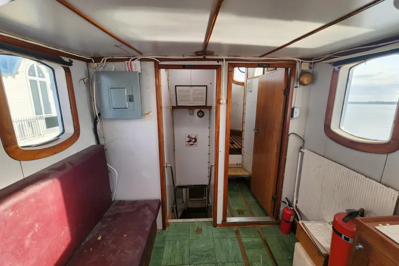 Slide: The Image of Interior of a 1960 Vintage Stord Verft 60 boat with wooden accents and seating. - 50