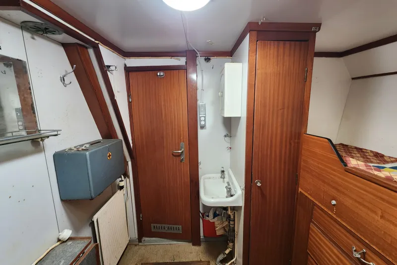 Slide: The Image of Interior of a 1960 Stord Verft model 60 ship cabin with wooden furnishings. - 64