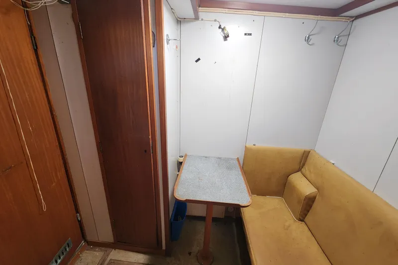 Slide: The Image of Small cabin interior with a table and cushioned seating, Stord Verft 60, 1960 model. - 66