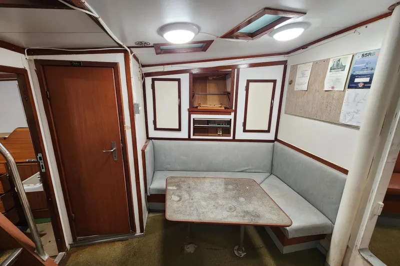 Slide: The Image of Interior of a 1960 Stord Verft model 60 ship, featuring a cozy seating area. - 70