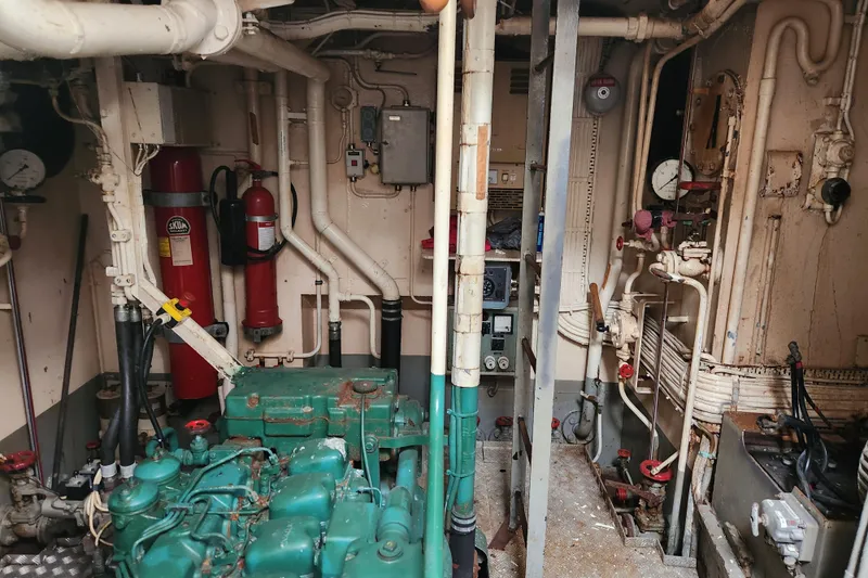 Slide: The Image of Engine room of a 1960 Stord Verft model 60 ship, featuring machinery and piping. - 80