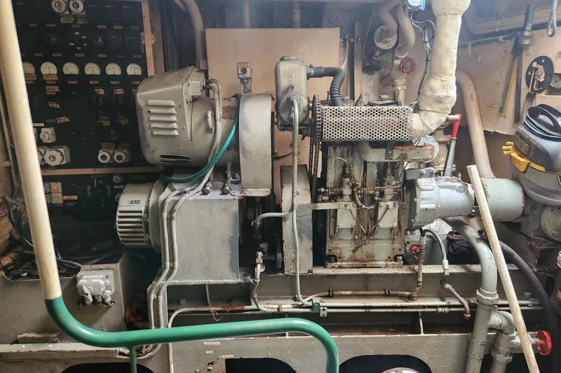 Slide: The Image of Engine room of a 1960 Stord Verft model 60, showcasing vintage machinery and controls. - 81
