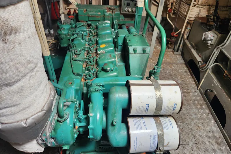 Slide: The Image of Green Stord Verft 60 engine from 1960 in a mechanical room setting. - 82