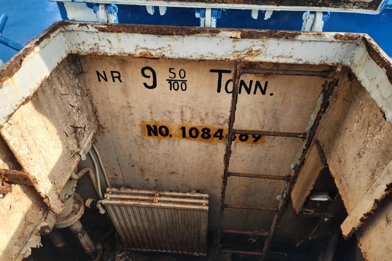 Slide: The Image of Rusty interior of a 1960 Stord Verft model 60 ship, showing weight markings. - 86