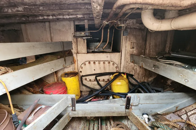Slide: The Image of Interior of a 1960 Stord Verft 60 vessel, showing storage area with equipment and pipes. - 87