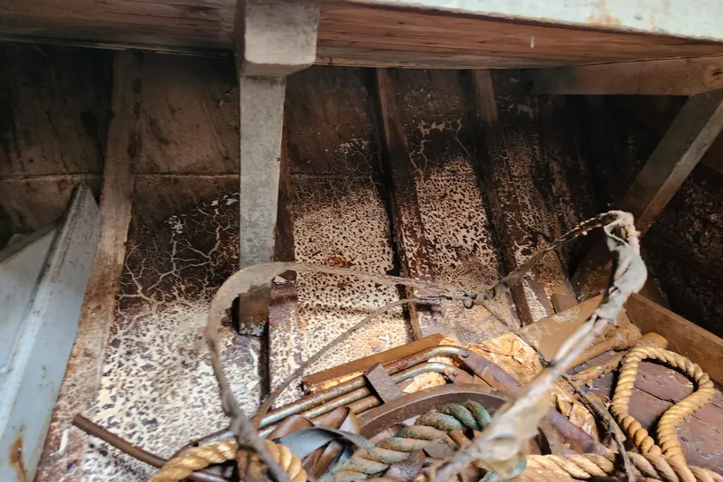 Slide: The Image of Interior of a vintage 1960 Stord Verft 60 boat, showing ropes and weathered surfaces. - 91