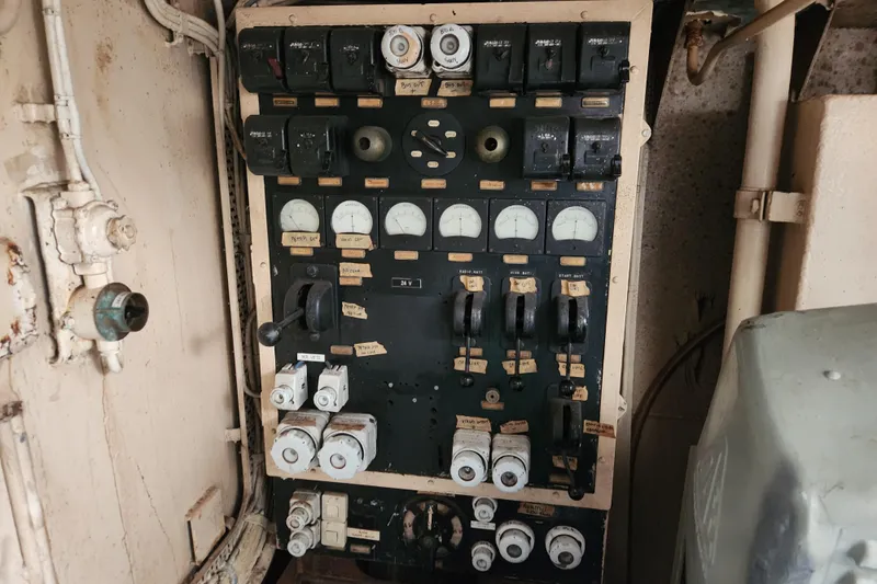 Slide: The Image of Vintage 1960 Stord Verft 60 control panel with gauges and switches in an industrial setting. - 97