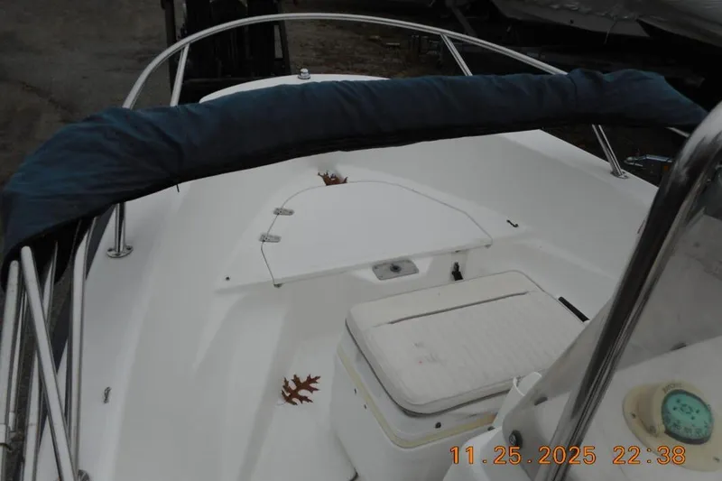 Slide: The Image of 2001 Boston Whaler 16 Dauntless boat interior with seating and storage compartments. - 5