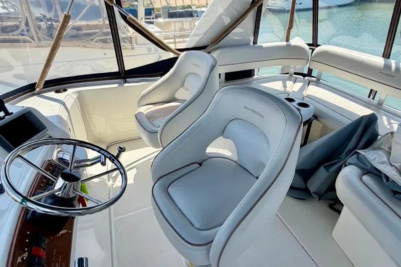 Slide: The Image of Interior of 2007 Silverton 36 Convertible yacht with steering wheel and seating. - 13