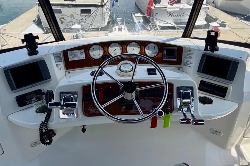 Slide: The Image of Helm of 2007 Silverton 36 Convertible yacht with steering wheel and navigation instruments. - 15