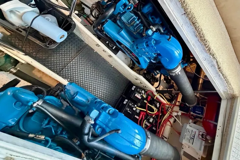 Slide: The Image of Engine room of 2007 Silverton 36 Convertible with blue Crusader engines and wiring. - 18
