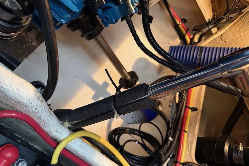 Slide: The Image of Engine compartment of a 2007 Silverton 36 Convertible boat with visible wiring and components. - 19