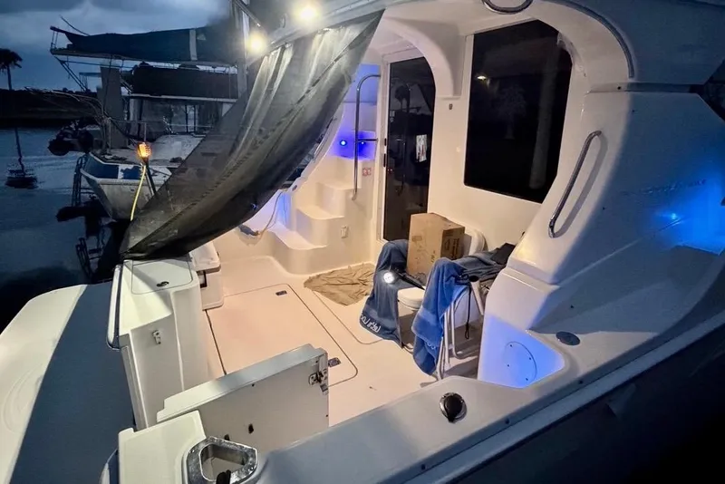 Slide: The Image of 2007 Silverton 36 Convertible yacht interior with ambient lighting at night. - 23