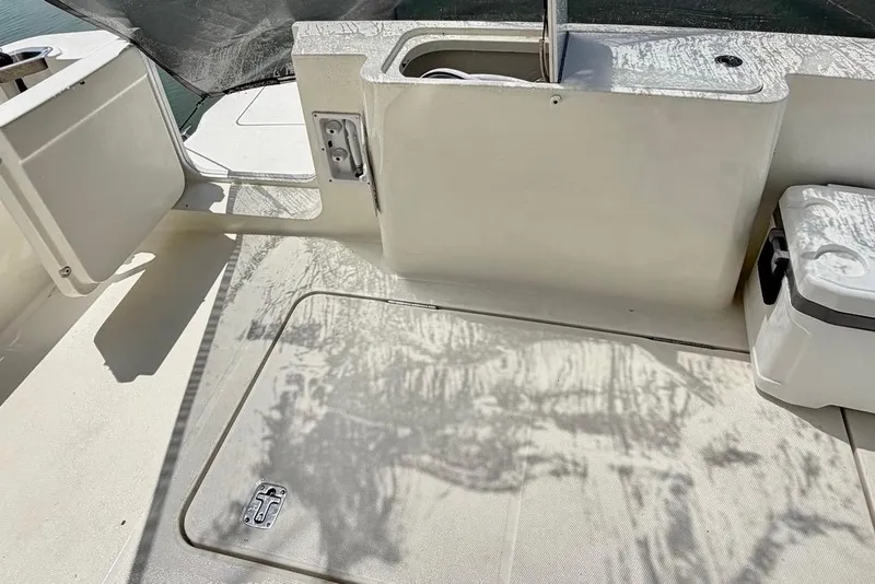 Slide: The Image of 2007 Silverton 36 Convertible boat deck with storage compartments and cooler. - 5