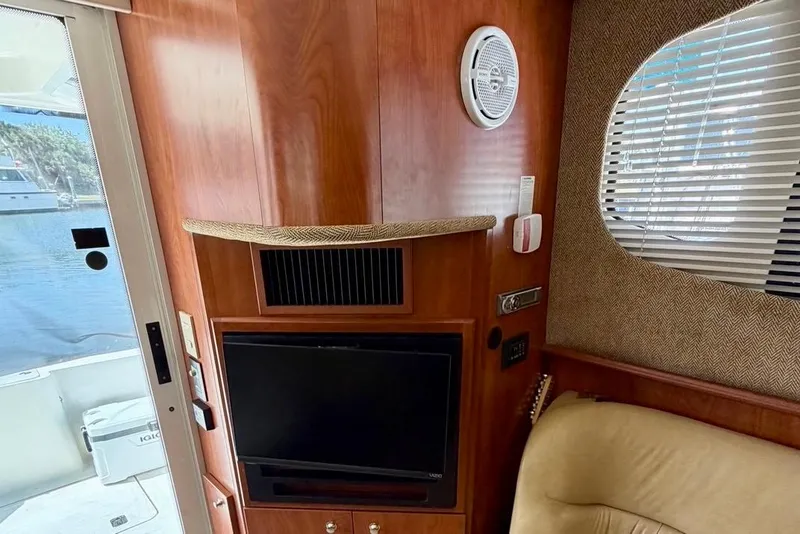 Slide: The Image of Interior of 2007 Silverton 36 Convertible yacht with TV and window blinds. - 6
